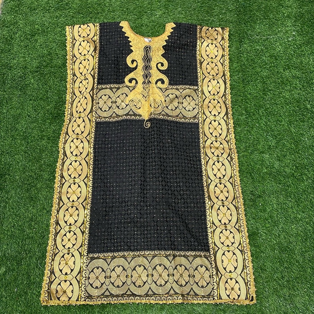 Black and gold tunic with metallic gold details.